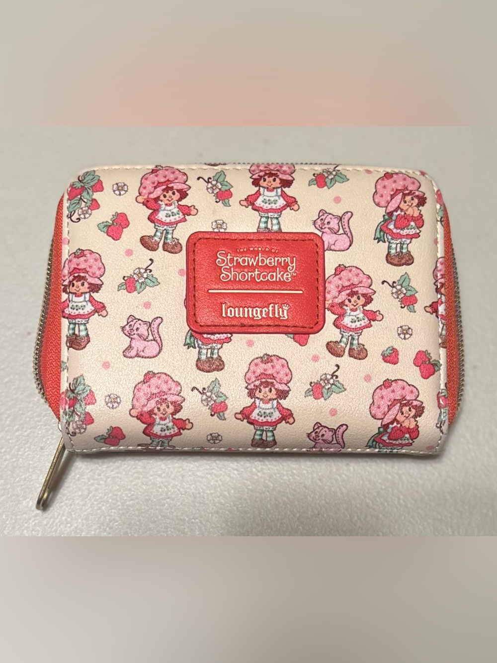 Cute and sweet, Loungefly Strawberry Shortcake and Custard Zip Wallet.